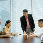 Korean workplace hierarchy shown through a manager-led team meeting
