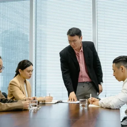 Korean workplace hierarchy shown through a manager-led team meeting