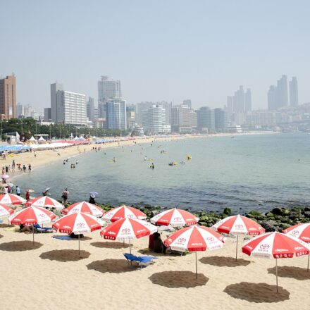 Korea summer beaches Busan Haeundae sandy shore and hotel skyline