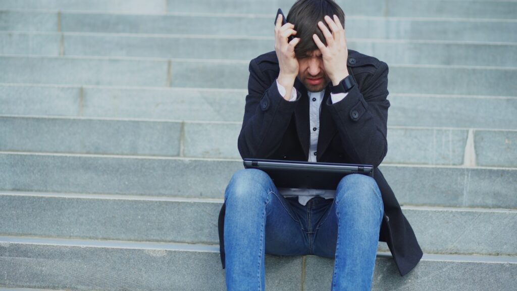 International student stress management — overwhelmed at the desk
