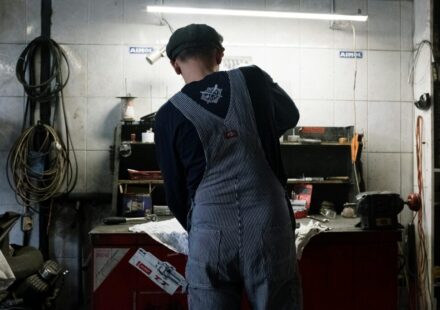 Used car inspection checklist - mechanic checking engine oil at a Korean auto repair shop