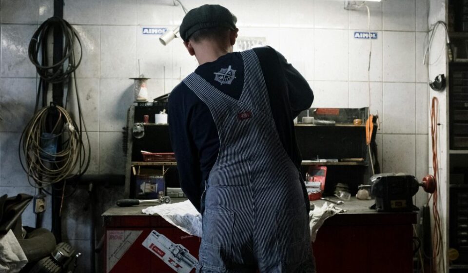 Used car inspection checklist - mechanic checking engine oil at a Korean auto repair shop