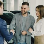 Used car vs new car — Korean dealership consultation scene