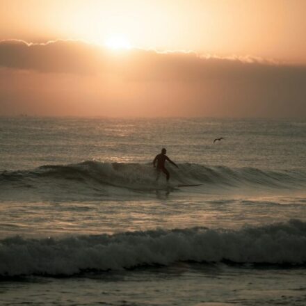 Yangyang surfing sunset — surfer silhouette at a Yangyang beach (Pexels)