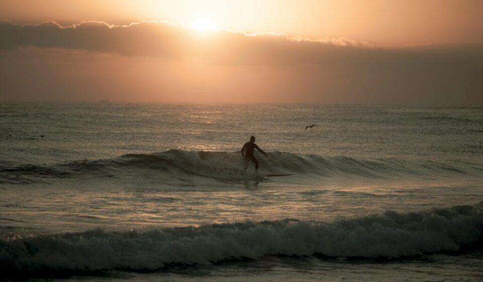Yangyang surfing sunset — surfer silhouette at a Yangyang beach (Pexels)