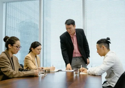 Korean workplace hierarchy shown through a manager-led team meeting