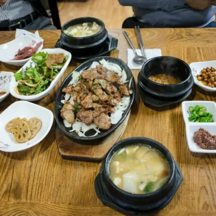 Korean food basics — a complete Korean home-style table spread with kimchi, banchan, and soup