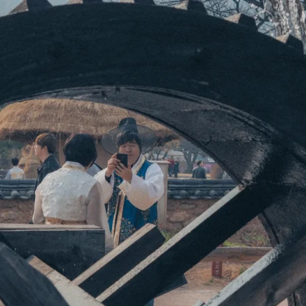 Travelers wearing hanbok in a Korean traditional village