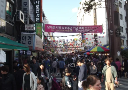 Crowded shopping alley in Namdaemun Market, Seoul